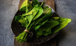 Fresh spinach wrapped on plate