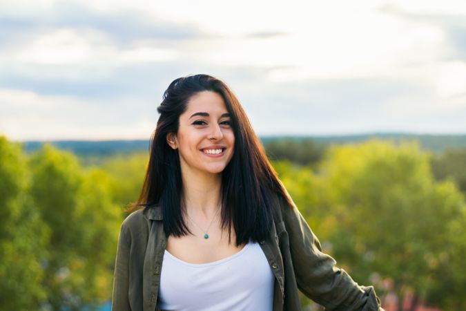 Smiling young woman portrait on a terrace