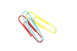 Color paper clips isolated on studio background, closeup