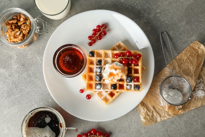Composition of breakfast with belgian waffles, top view