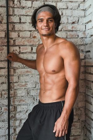 Muscular man posing in gym