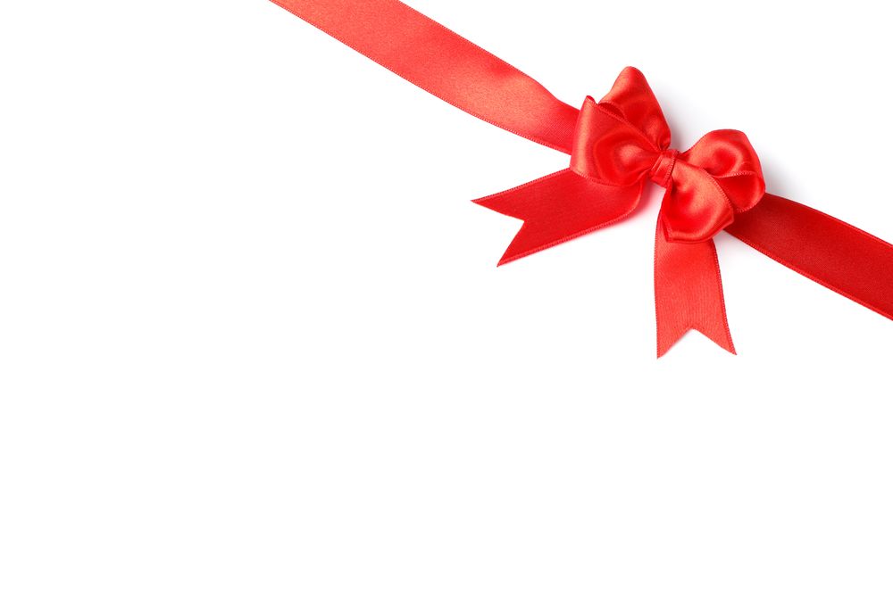 Red ribbon with bow isolated on plain background. Gift concept