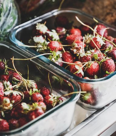 Strawberries in glass containers, selective focus