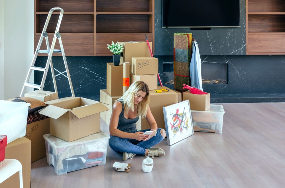 Woman unpacking moving boxes