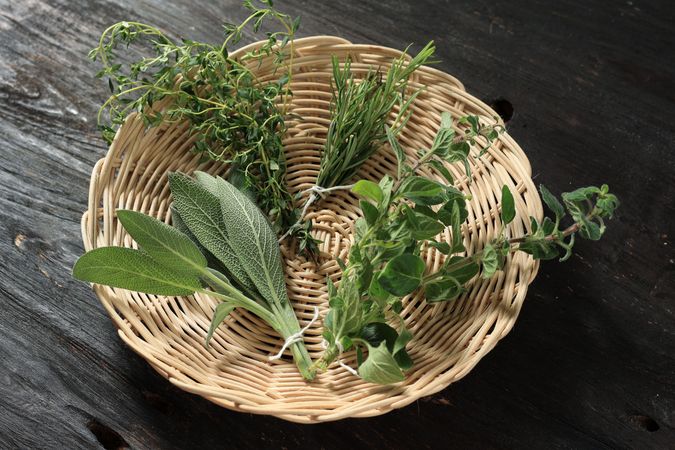 Various Herbs on Wooden Background.