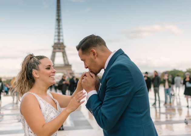 Happy newlyweds in wedding clothing kissing