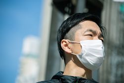 Man with light face mask