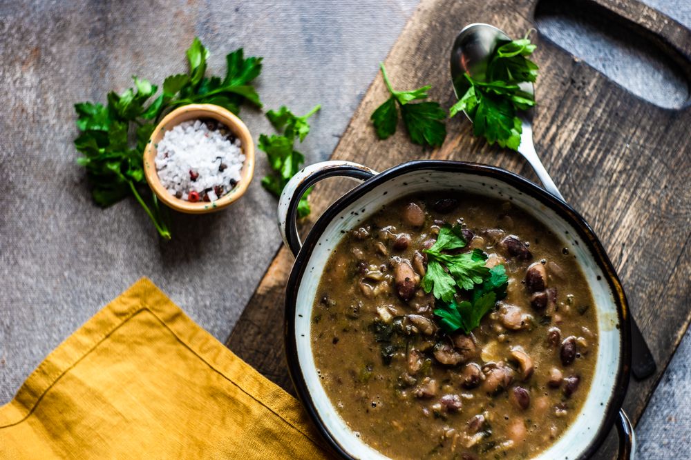 Top view of delicious hearty bean soup with parsley