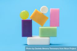 Multicolored soaps stack on a blue background 4AnOzb