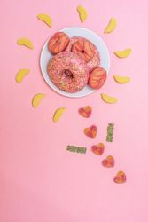 Pink doughnuts in a flower shape made with candies