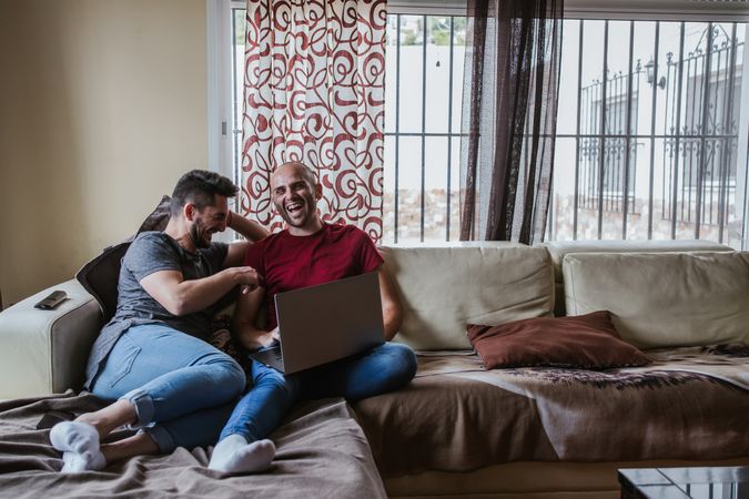 Gay couple with computer