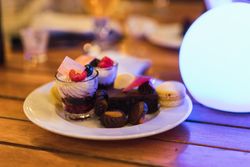 Plate with desserts on table