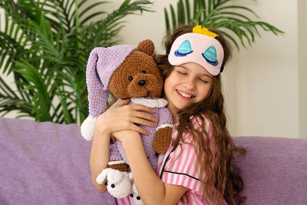 Girl hugging teddy bear