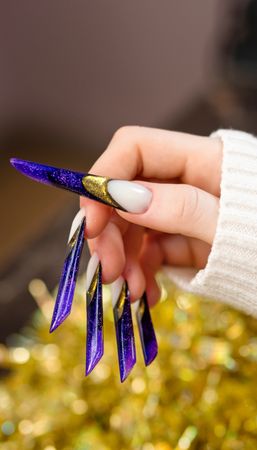 Glittering Purple Stiletto Nails