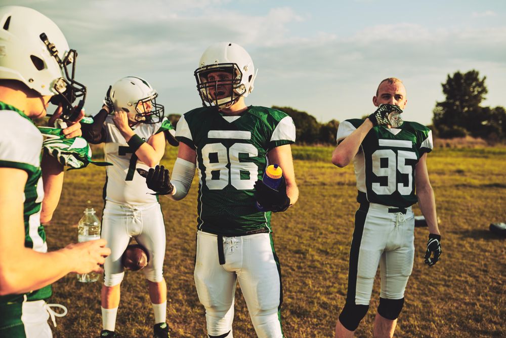 Football team having a discussion after a game