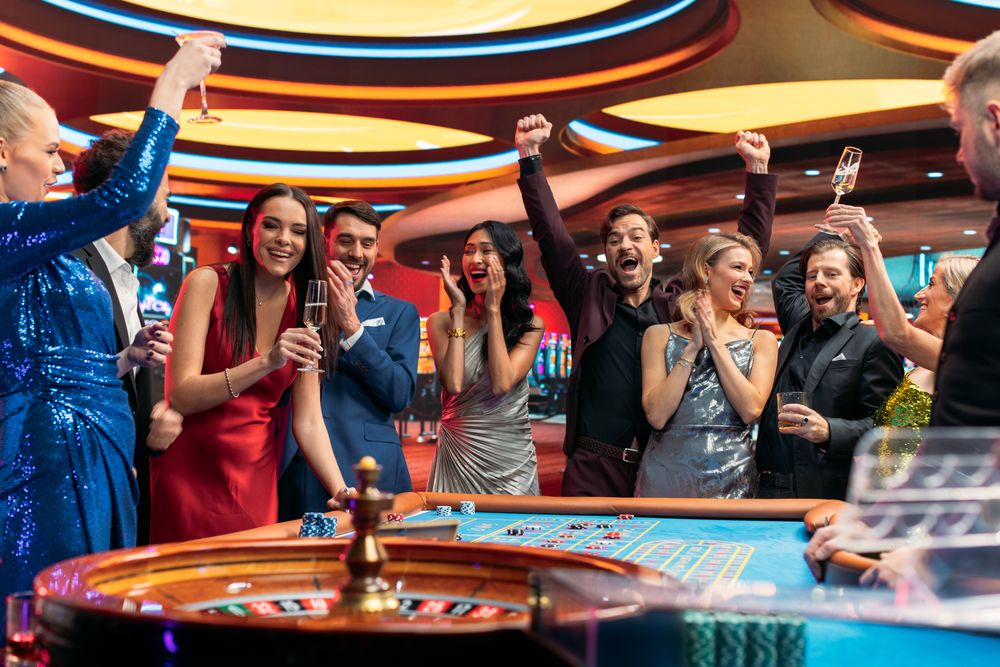 Group of Multiethnic Young Men and Women Entertaining Themselves with a Game of Roulette.
