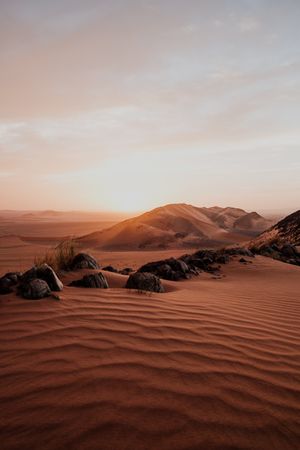Sunset sky over hills in desert