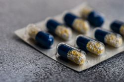 Close up of pills on grey counter