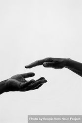 Monochrome photo of two people's hands 4jwa3b