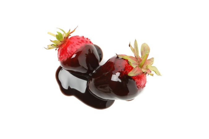 Chocolate fondue. Strawberry in chocolate sauce isolated on plain background