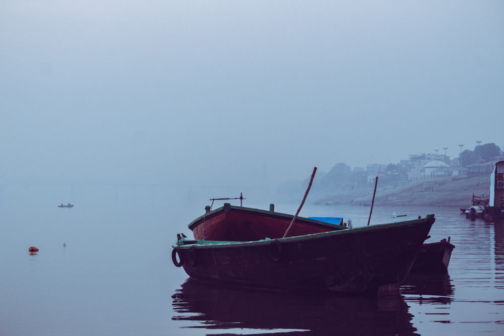 Dinghies on water in fog