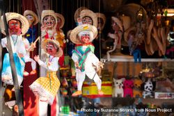 Traditional Mexican marionettes for sale at market 5qWyJb