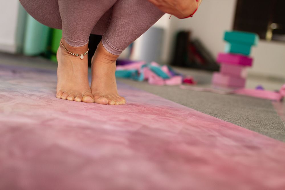 Woman in sitting pose on yoga mat