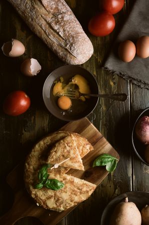 Cooking ingredients around pie on table