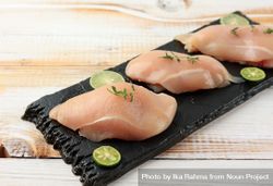 Raw chicken breast with lime ready for cooking 49dgB5