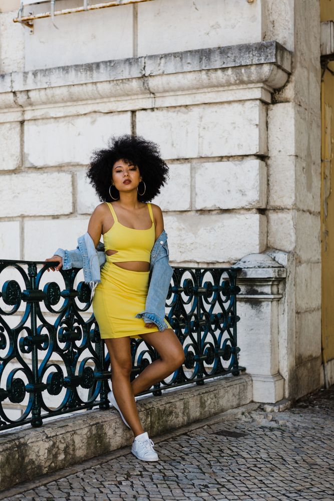 Stylish female leaning on railing outdoors