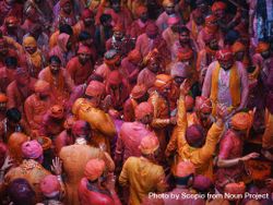Group of men covered with bright paintings as ritual in celebrating Holi in India 48ngq0