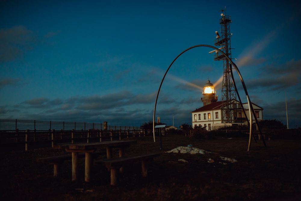 Road and lighthouse in evening