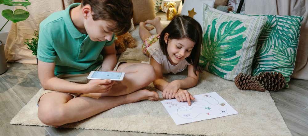 Children playing in a cozy diy tent at home