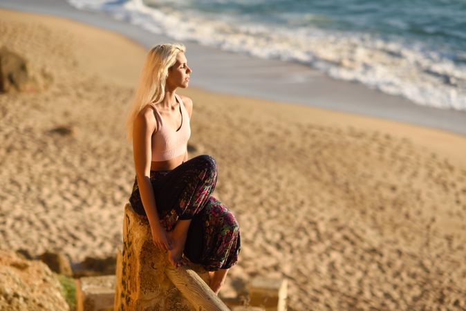 Blonde woman relaxing in the sun on a Spanish beach