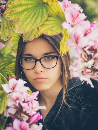 Woman on background of stunning violet flowers