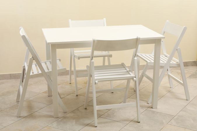 table and folding chairs in kitchen room