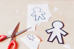 Funny paper toys near scissors