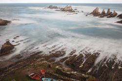 Wonderful ocean rocky coast in fair weather