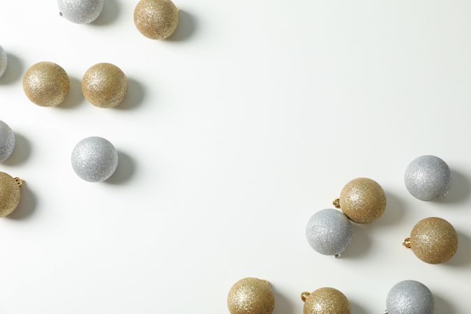 Flat lay with christmas balls on plain background, space for text