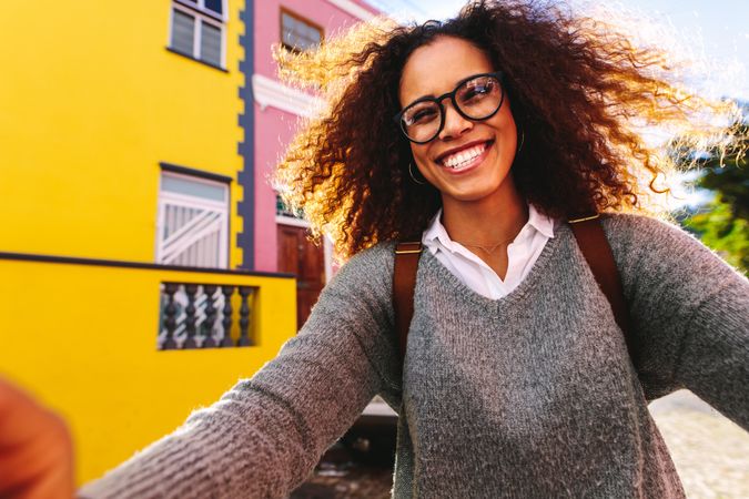 Biracial woman talking selfie outdoors