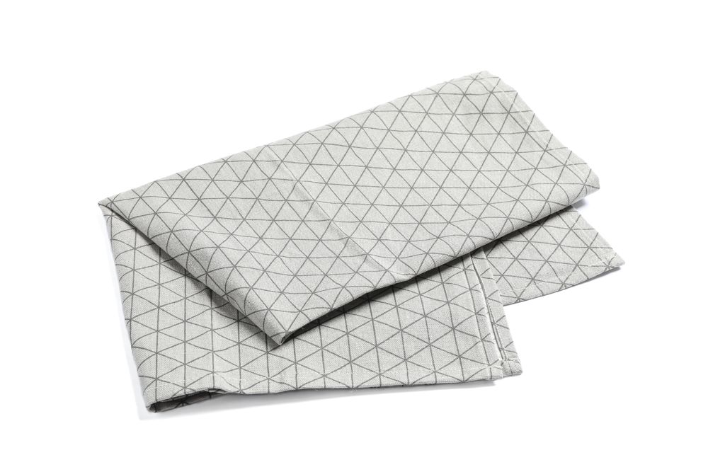 Folded grey napkin isolated on blank background