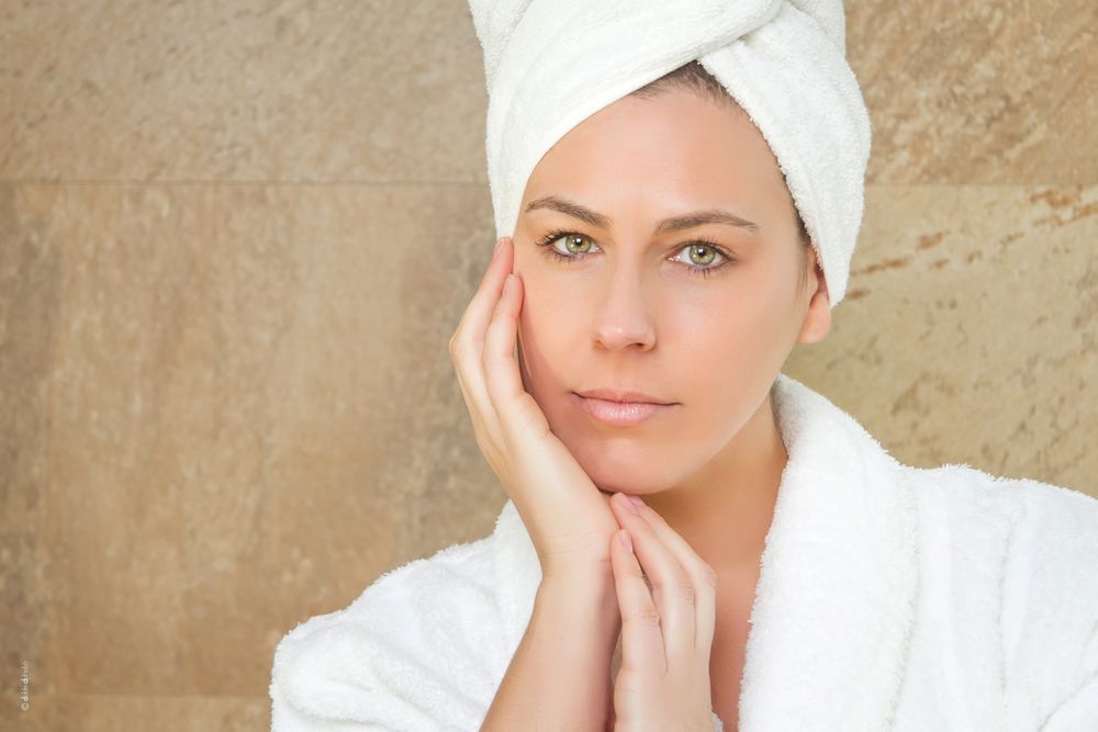 Portrait of woman with a white bathrobe