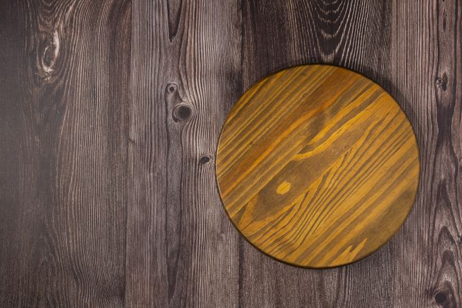 Empty pizza board on rustic wooden table. Top view image.