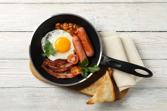 Pan of breakfast on wooden table