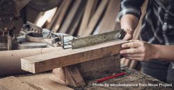 Banner of carpenter hand working on woodworking, measuring wood with ruler and pencil 4d88wr