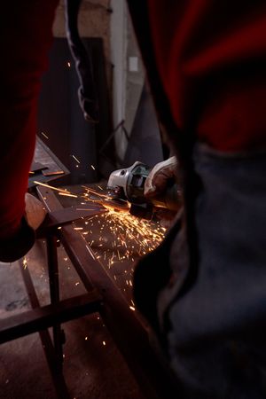 Laborer working with metal slab
