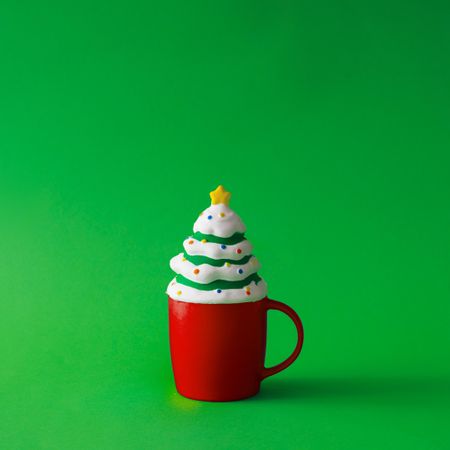 Cup of coffee with tree decoration