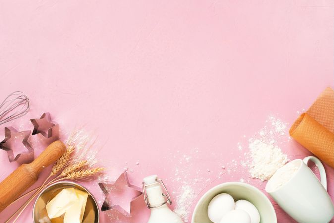 Pink background with raw ingredients for baking