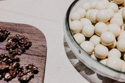Tasty fresh candies on plate and board
