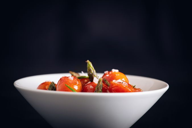 Fresh cherry tomatoes sauteed with green asparagus and rosemary